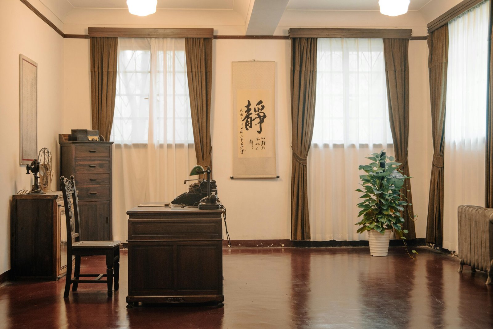 A vintage-style office room in Meiling Palace, Nanjing, featuring classic wooden furniture and Chinese decor.